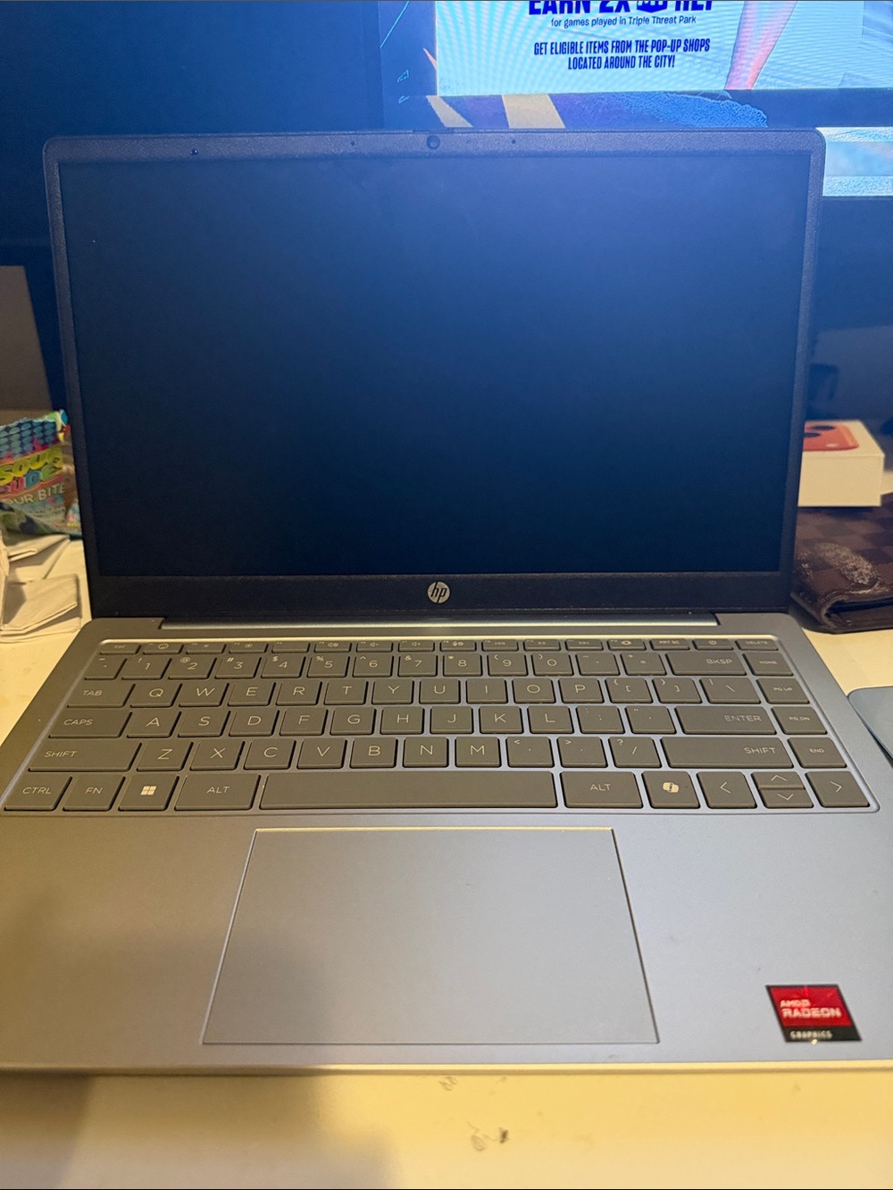 HP Silver Laptop with Gray Keyboard and AMD Radeon Badge